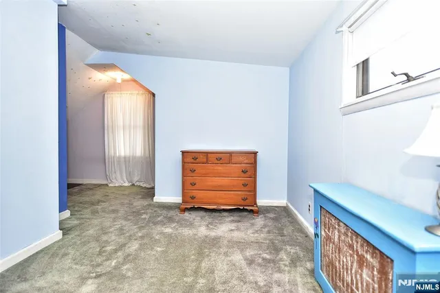 a picture of a bench in front of a wall