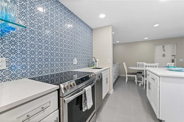 a kitchen with a stove and a sink