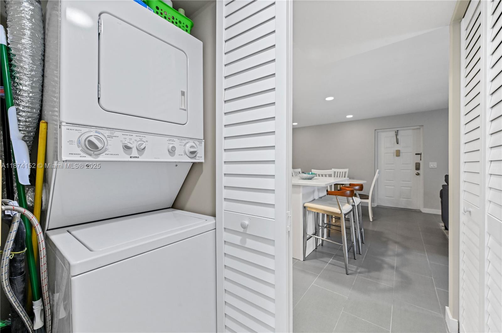 812 Sky Pine Way, Unit C2 Greenacres, FL 33415 - Photo 13 of 25 a view of washer and dryer with bathroom in the background