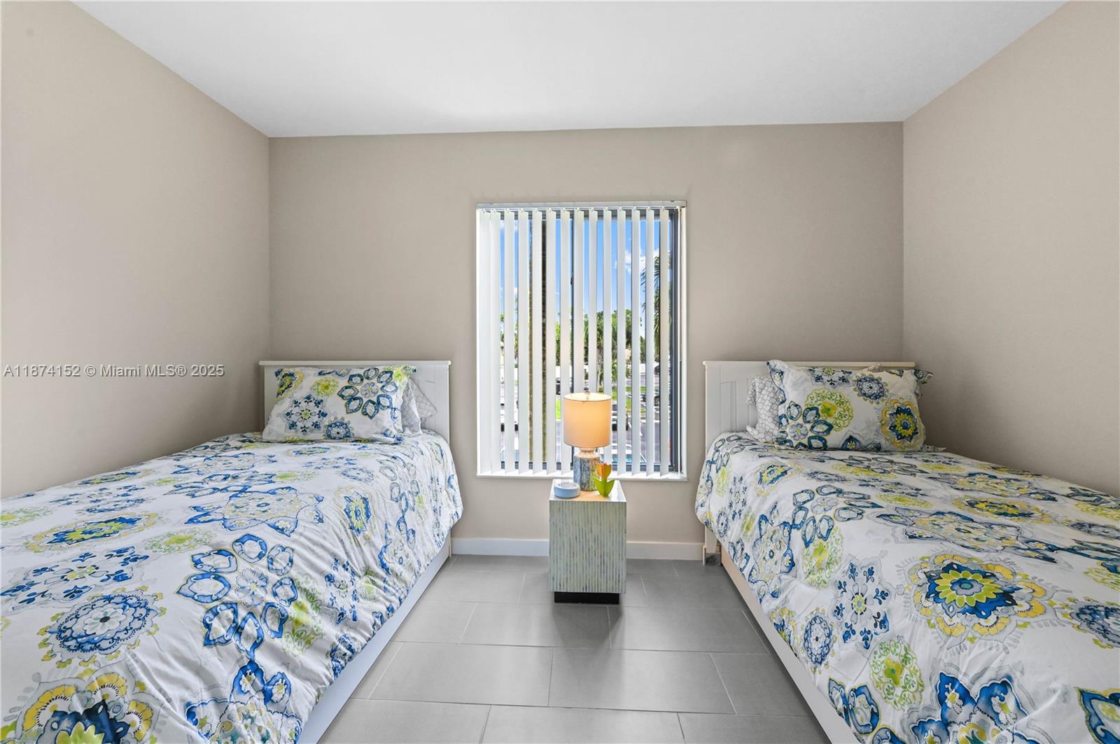 812 Sky Pine Way, Unit C2 Greenacres, FL 33415 - Photo 16 of 25 a bedroom with a bed and a window