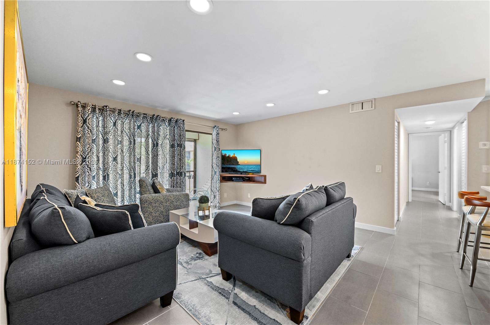812 Sky Pine Way, Unit C2 Greenacres, FL 33415 - Photo 4 of 25 a living room with furniture and a wooden floor