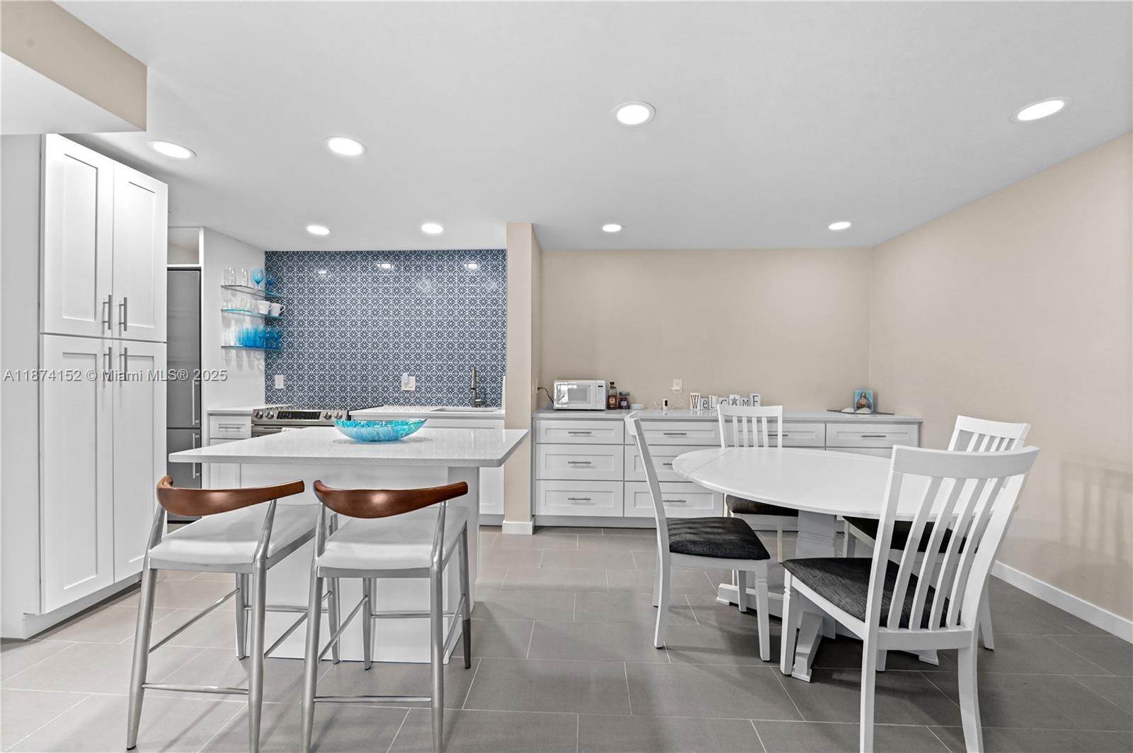 812 Sky Pine Way, Unit C2 Greenacres, FL 33415 - Photo 9 of 25 a dining room with a table and chairs