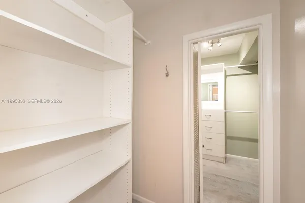 a bathroom with a sink vanity tub and shower