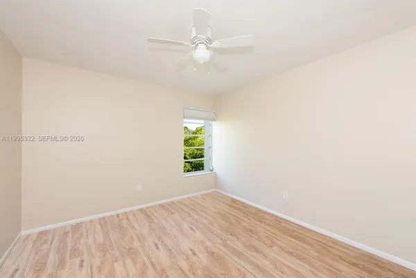 a view of an empty room with a window