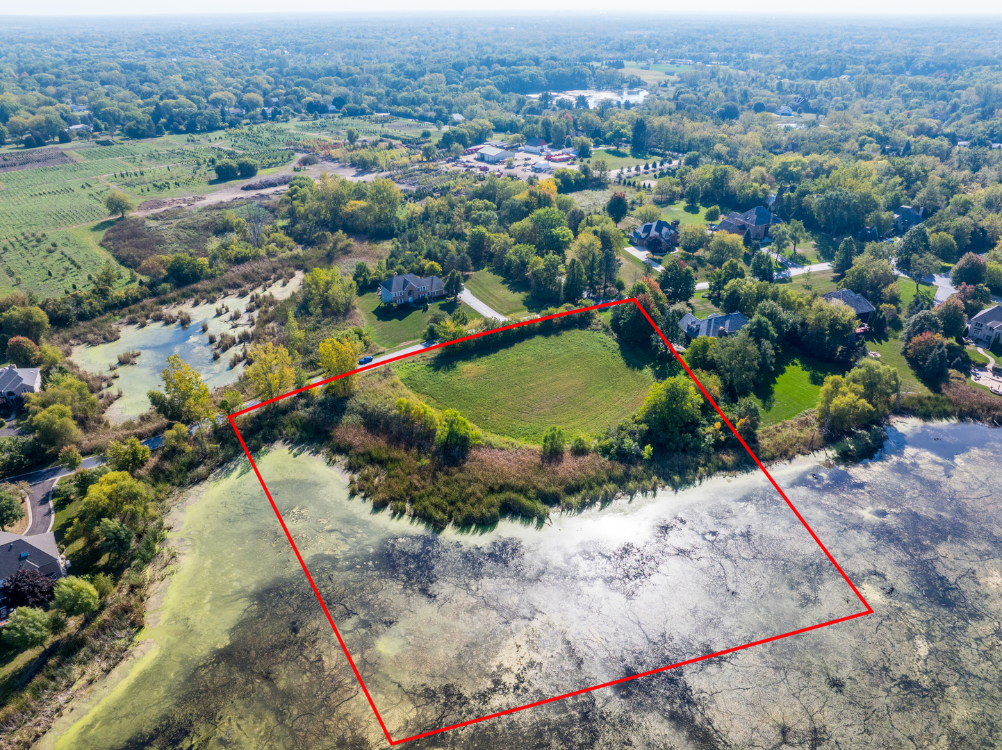 6857 Ellis Drive Long Grove, IL 60047 - Photo 7 of 17 an aerial view of a houses with a yard and lake