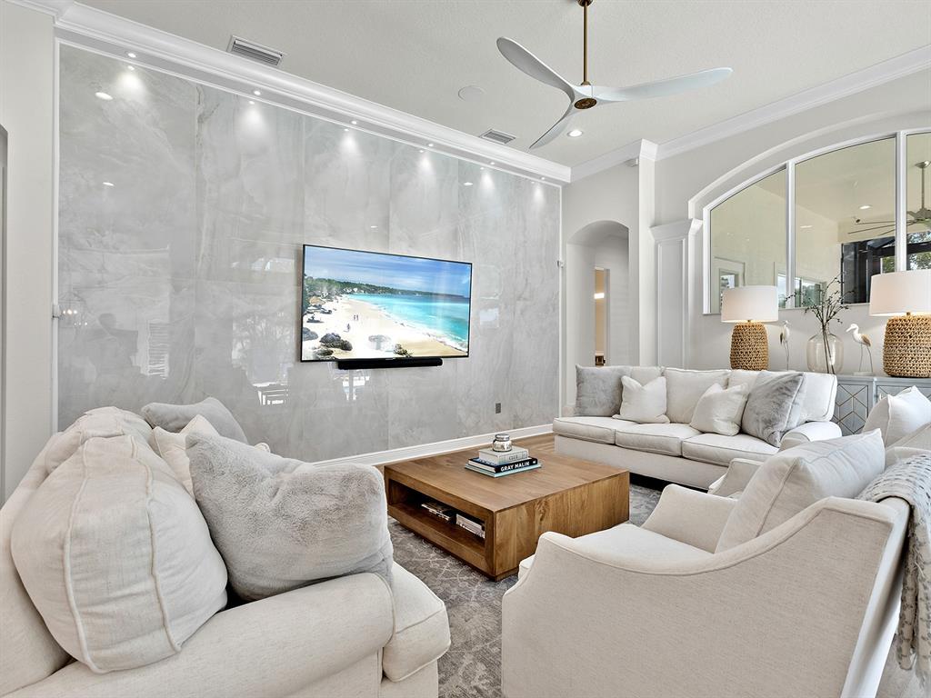 7431 Greystone Street Lakewood Ranch, FL 34202 - Photo 31 of 85 a living room with furniture and a flat screen tv
