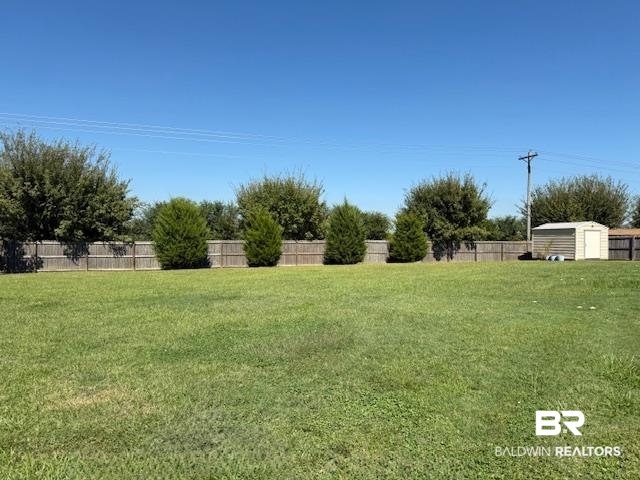 15577 Talus Court Foley, AL 36535 - Photo 22 of 28 Fenced backyard with a shed