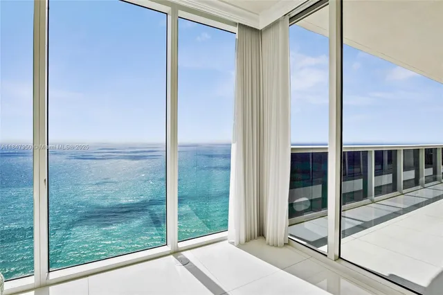 a view of a glass door of the house