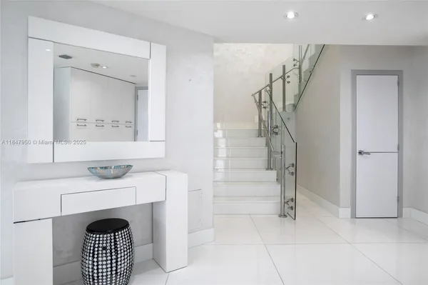 a view of an entryway with fireplace and door