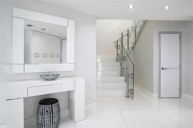 a view of an entryway with fireplace and door