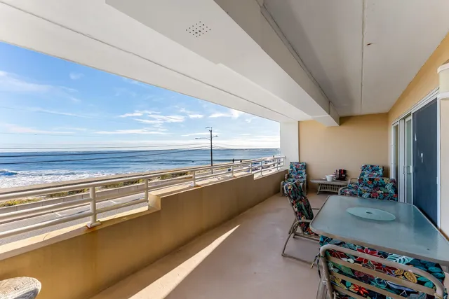 a view of a room with a floor to ceiling window