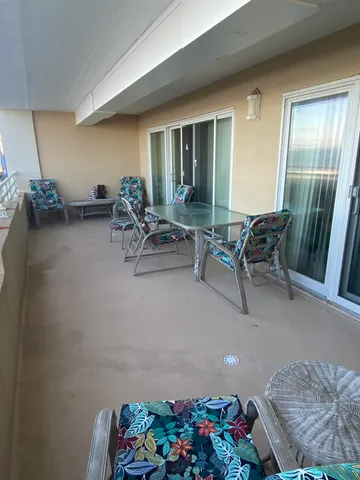 a kitchen with a table chairs stove and cabinets