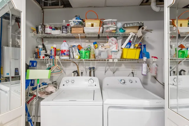 a spacious bedroom with a bed and a flat screen tv
