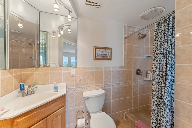 a bathroom with a bathtub and shower