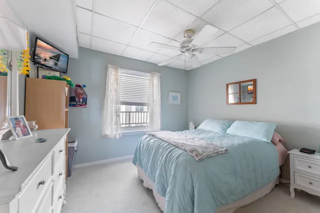 a spacious bathroom with a granite countertop sink toilet and shower