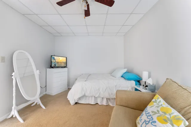 a bedroom with a bed and a couch