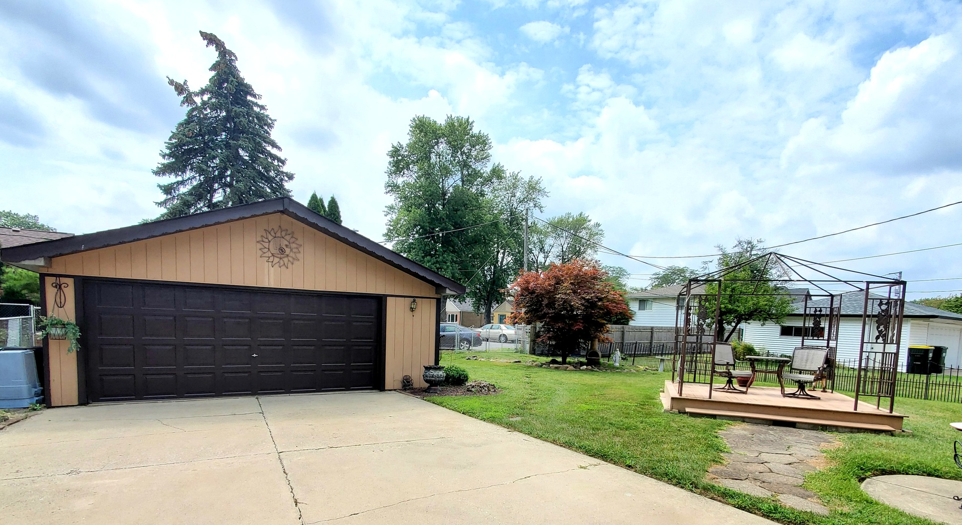 6139 107th Street Chicago Ridge, IL 60415 - Photo 16 of 16 a front view of a house with a garden and trees