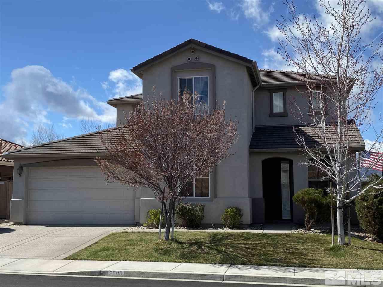 2500 Country Falls Lane Reno, NV 89521 - Photo 1 of 23 a front view of a house with garden