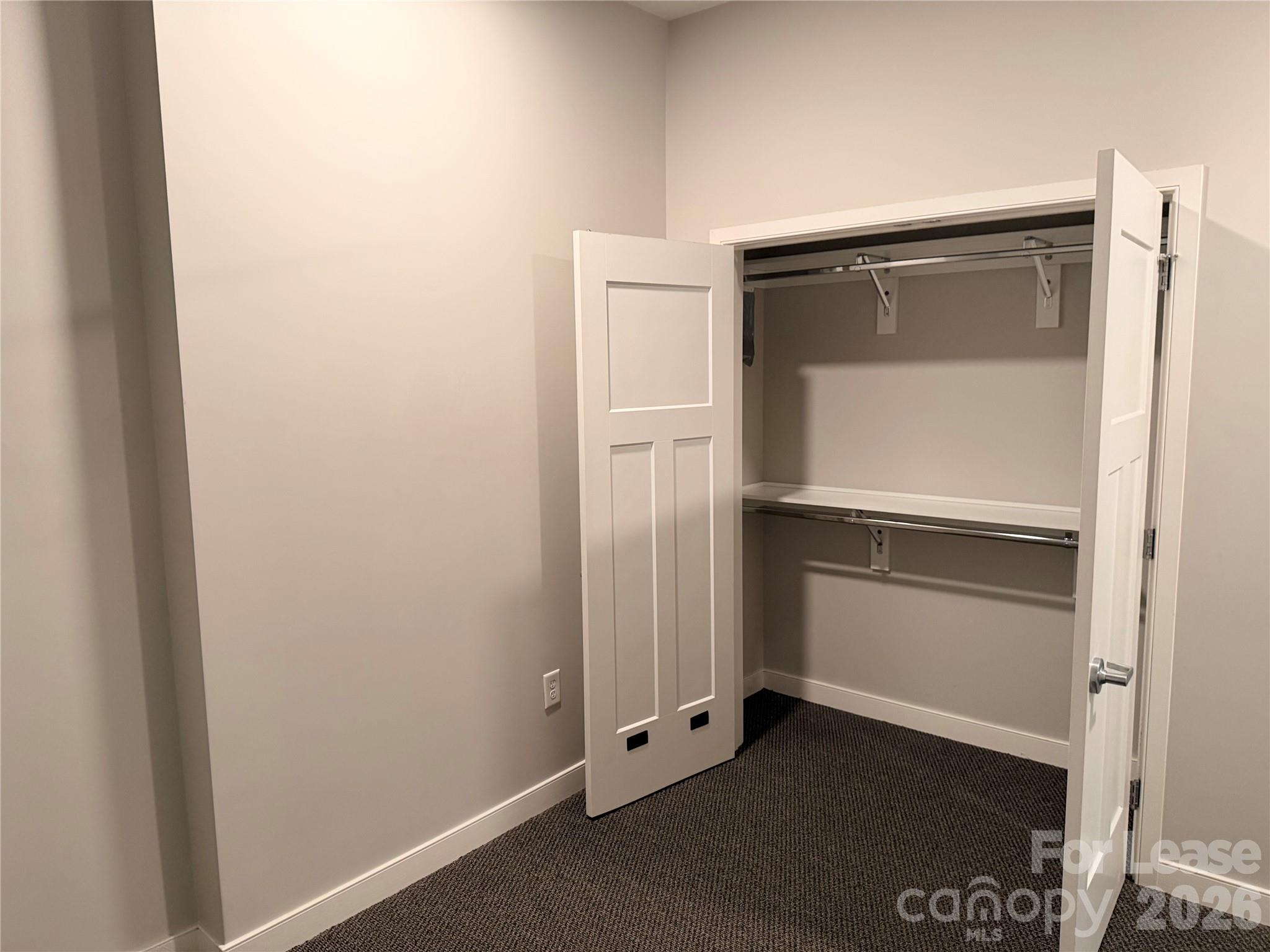 201 East Innes Street, Unit 202 Salisbury, NC 28144 - Photo 11 of 16 an empty room with closet