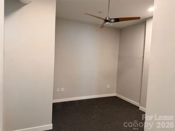 a view of a small space with wooden floor