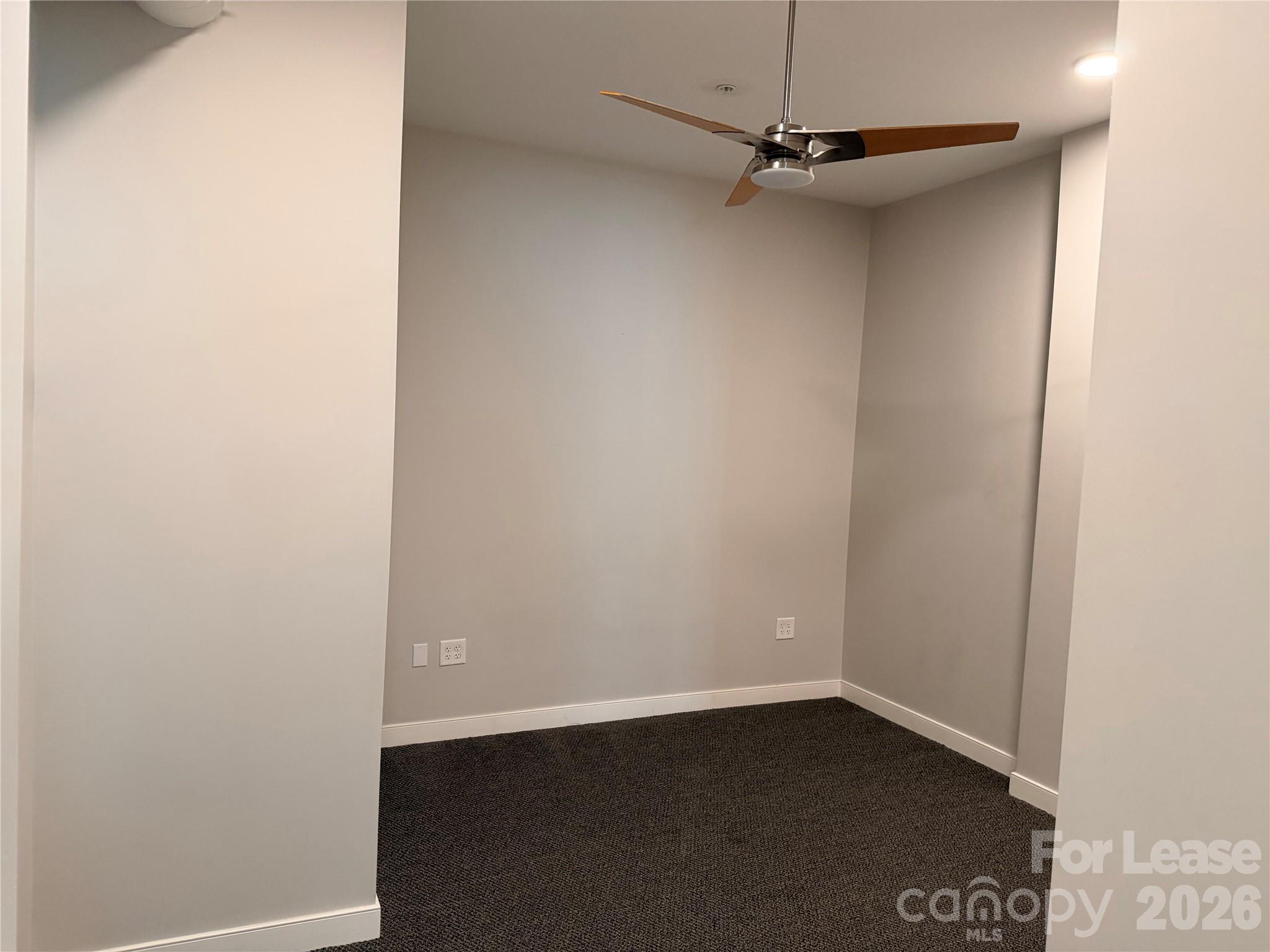 201 East Innes Street, Unit 202 Salisbury, NC 28144 - Photo 12 of 16 a view of a small space with wooden floor