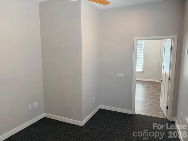 an empty room with wooden floor
