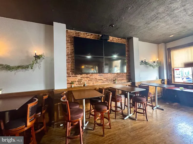 a view of a dining room with furniture and window