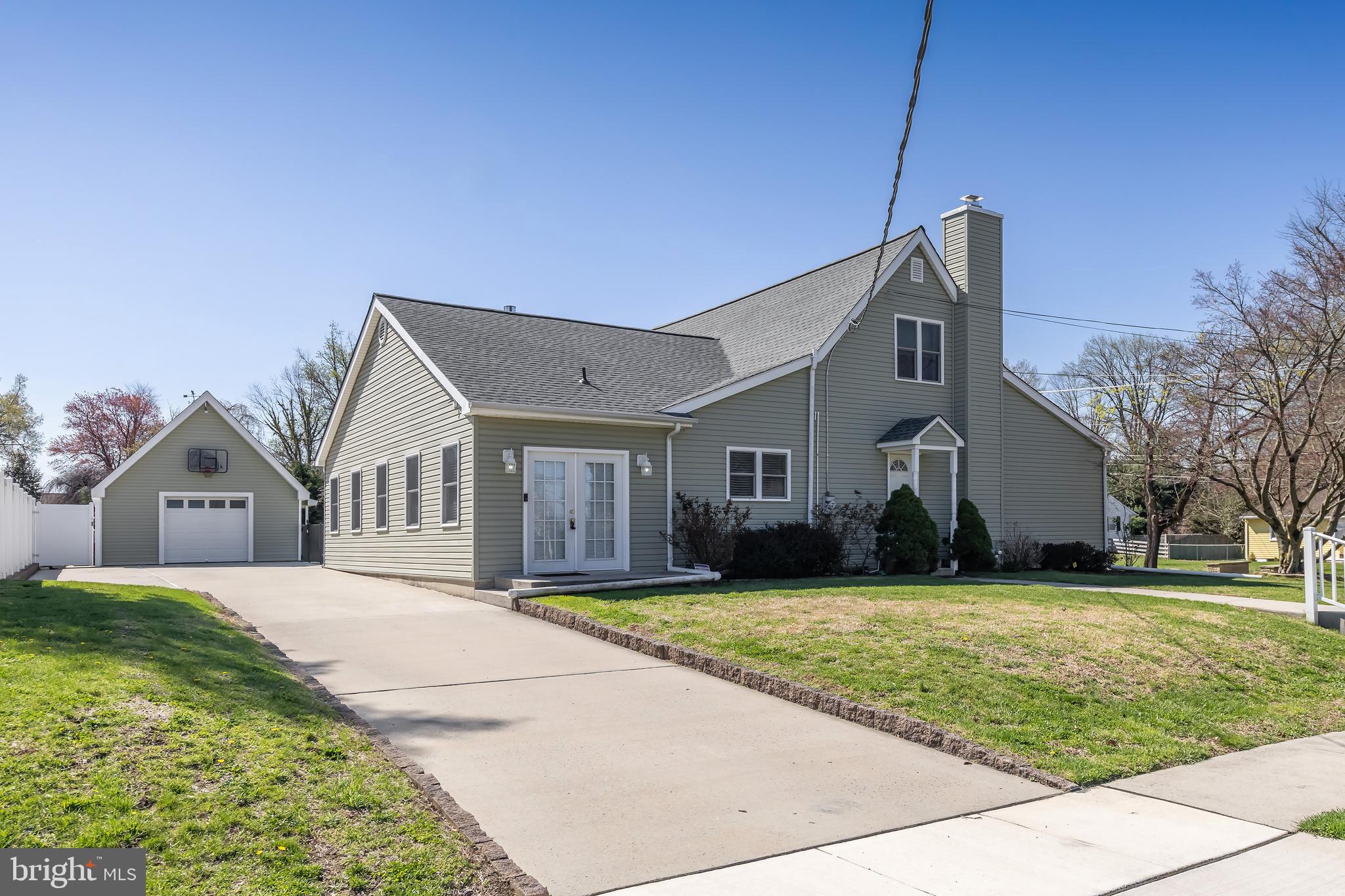 303 Main Street Mantua, NJ 08051 - Photo 2 of 50 a front view of a house with a yard