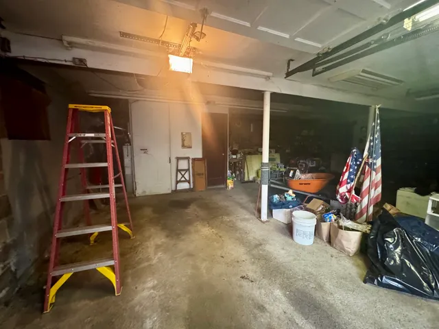 a view of a room with wooden floor and windows