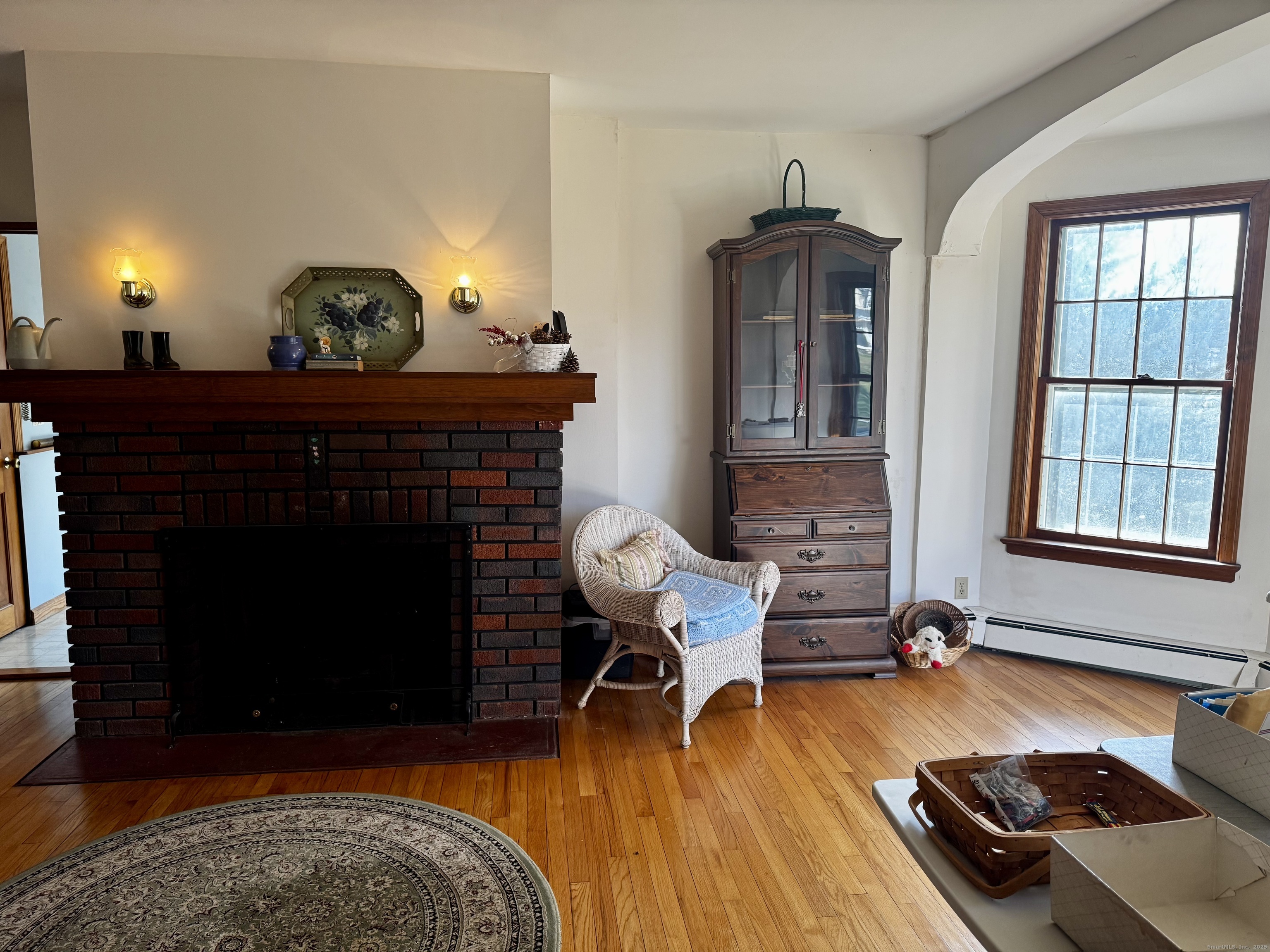 58 Daniels Farm Road Trumbull, CT 06611 - Photo 10 of 40 a living room with furniture and a fireplace