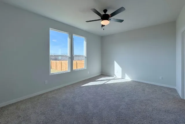 an empty room with a empty space and a window