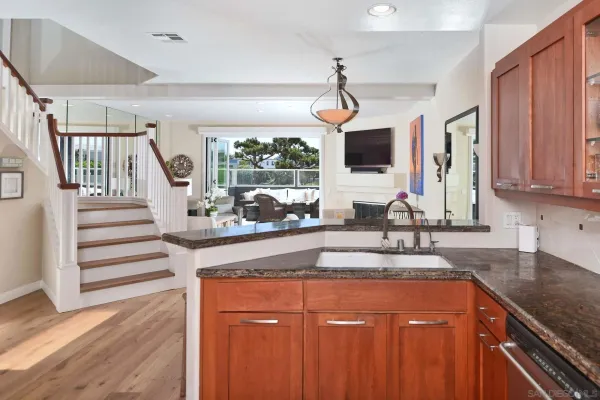 a kitchen with a sink cabinets and window