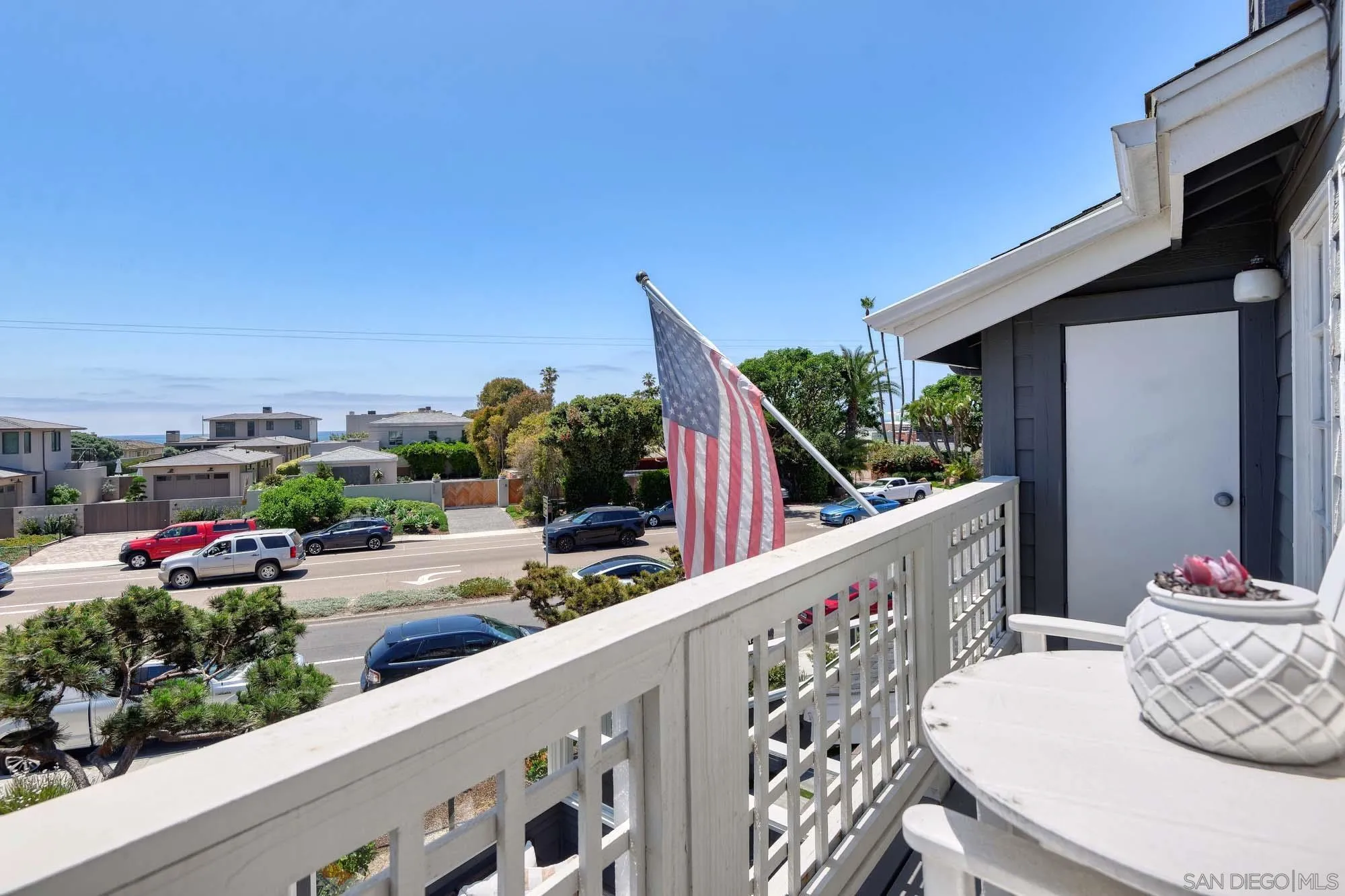 2921 Sandy Pointe, Unit 3 Del Mar, CA 92014 - Photo 15 of 31 a balcony with wooden floor and outdoor seating