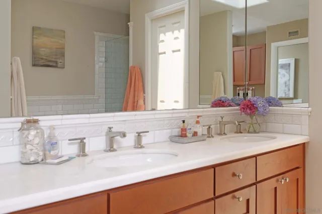 a bathroom with sink and mirror