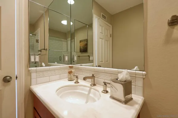a bathroom with a sink and a mirror