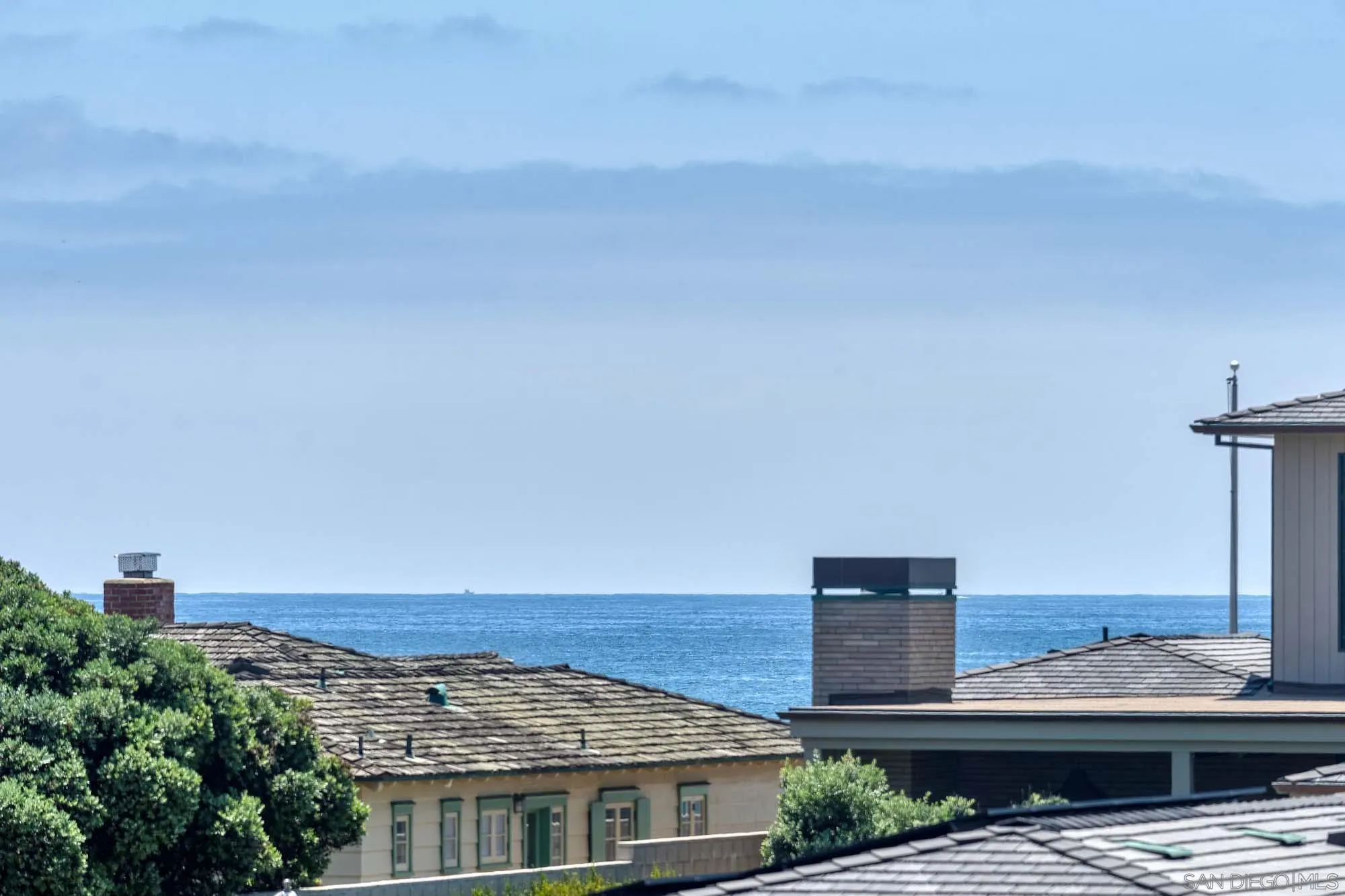 2921 Sandy Pointe, Unit 3 Del Mar, CA 92014 - Photo 2 of 31 a view of a city with tall buildings