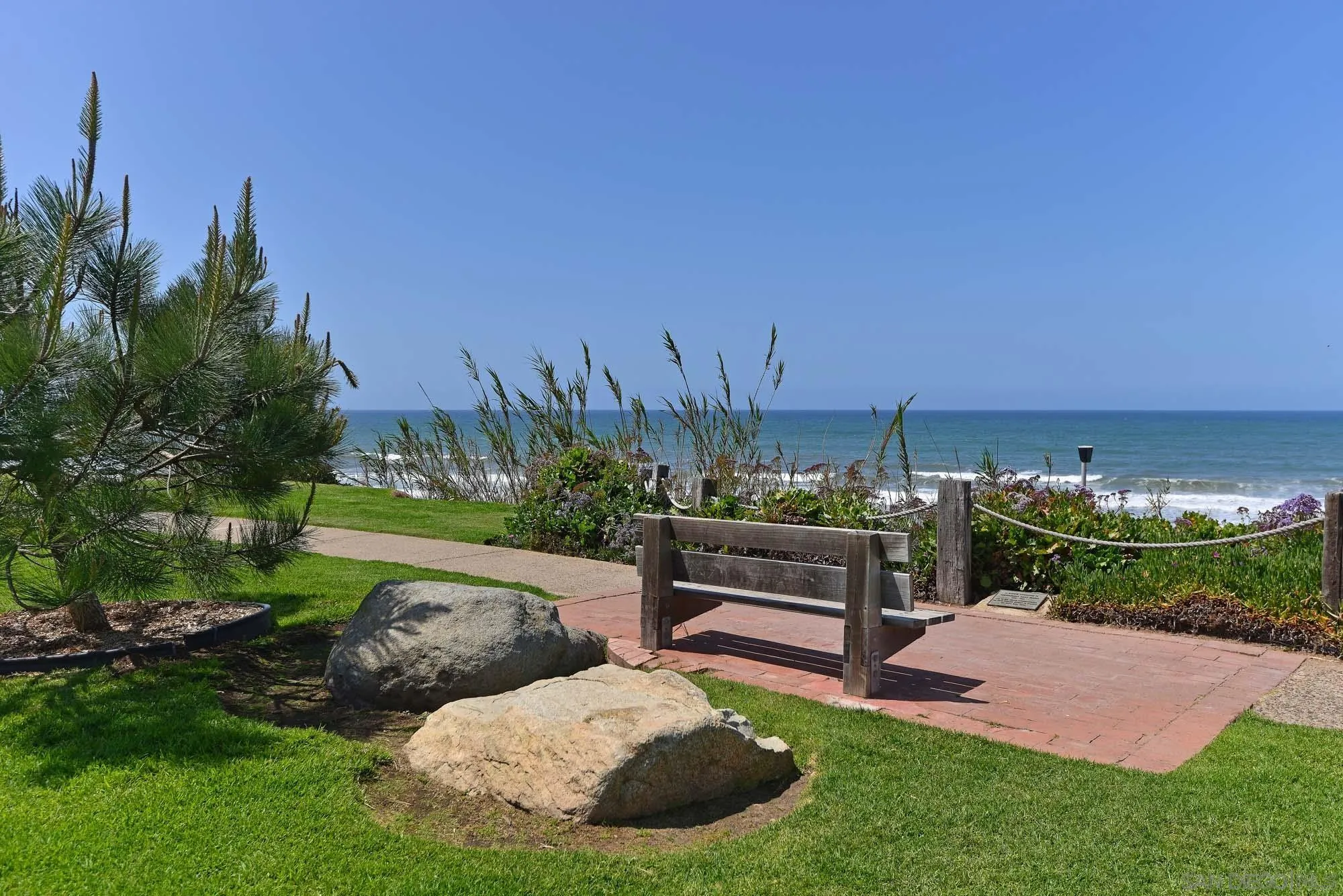 2921 Sandy Pointe, Unit 3 Del Mar, CA 92014 - Photo 26 of 31 a view of a garden with lawn chairs