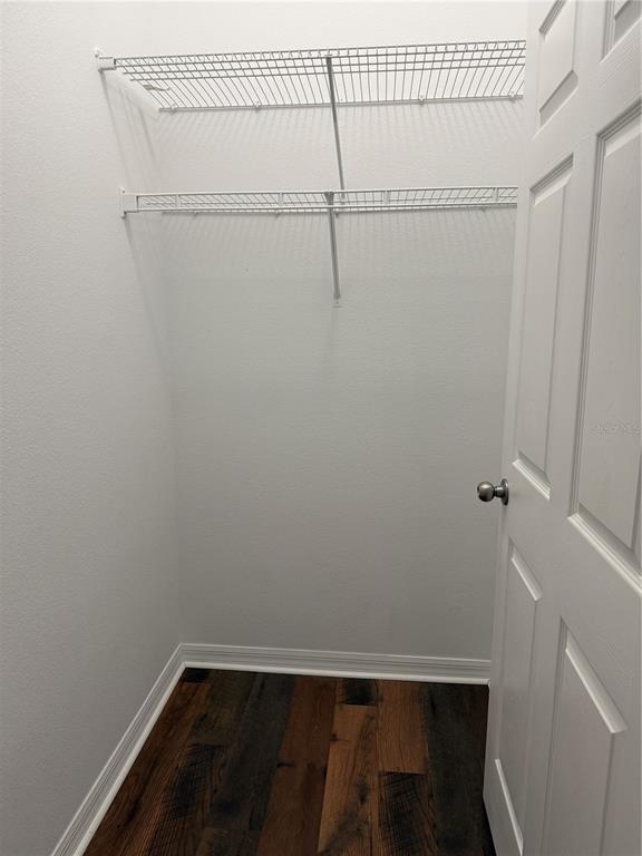 970 North Spring Garden Avenue, Unit 311 DeLand, FL 32720 - Photo 14 of 16 a view of a room with racks on the wall