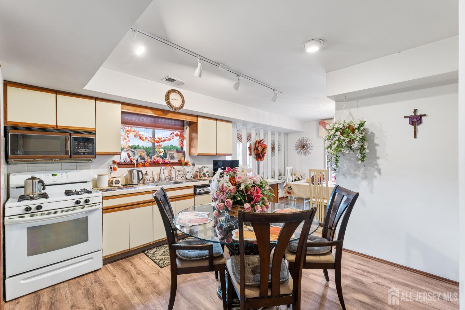 236 Community Circle Old Bridge, NJ 08857 - Photo 14 of 46 a view of a dining room with furniture and window