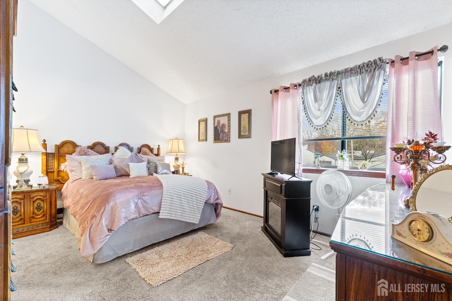 236 Community Circle Old Bridge, NJ 08857 - Photo 20 of 46 a spacious bedroom with a bed and a window
