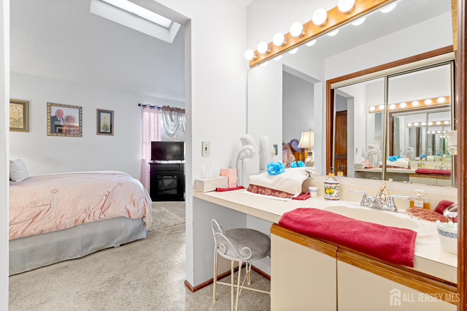 236 Community Circle Old Bridge, NJ 08857 - Photo 22 of 46 a bedroom with a bed and dresser with mirror