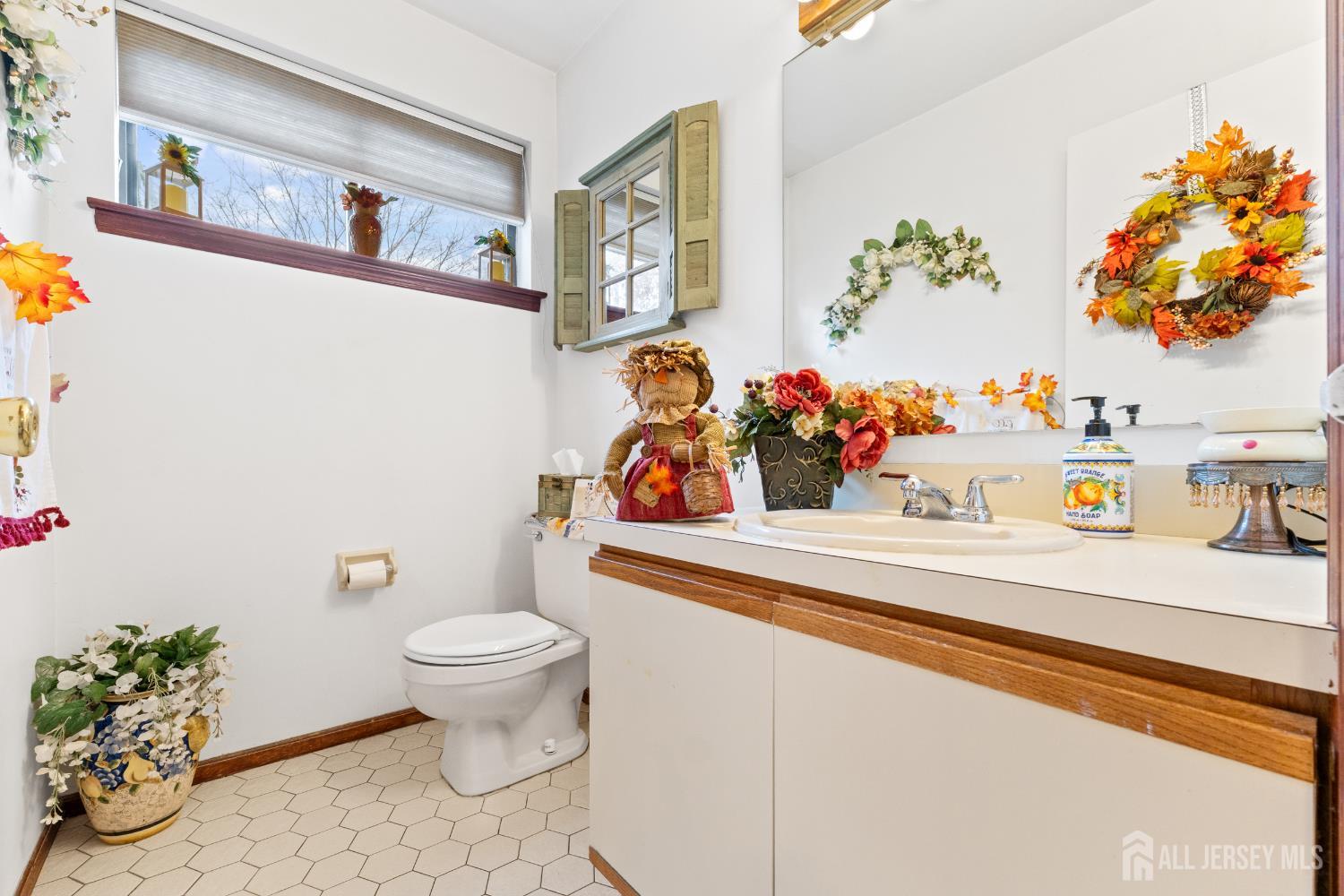 236 Community Circle Old Bridge, NJ 08857 - Photo 27 of 46 a bathroom with a toilet sink and mirror