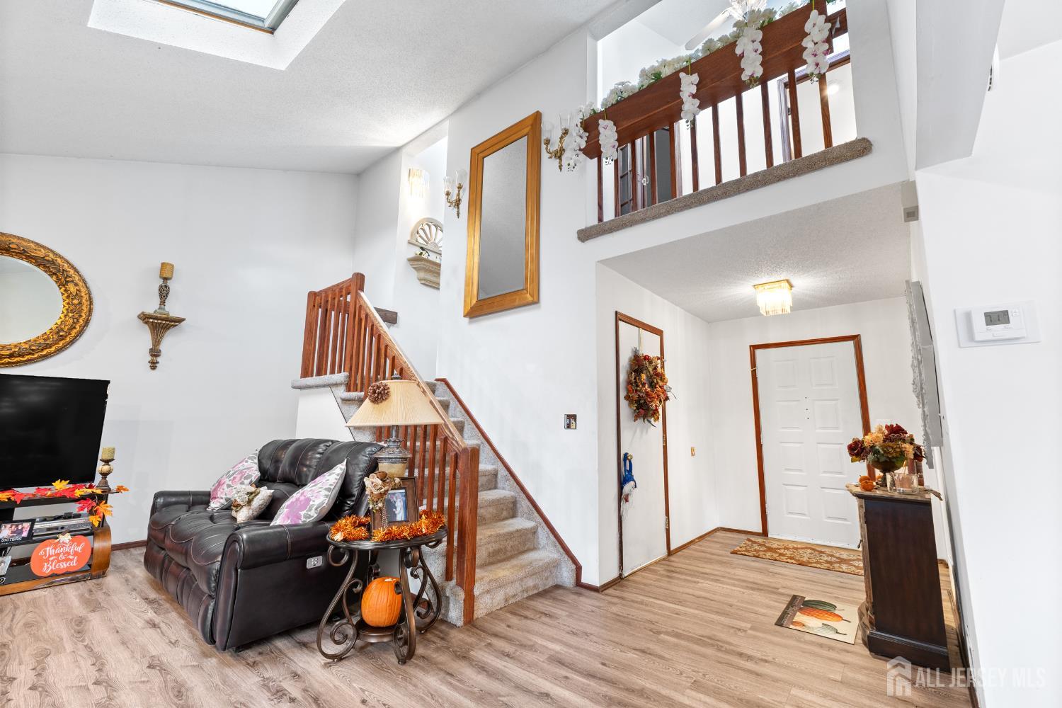 236 Community Circle Old Bridge, NJ 08857 - Photo 10 of 46 a view of a livingroom with furniture and a flat screen tv