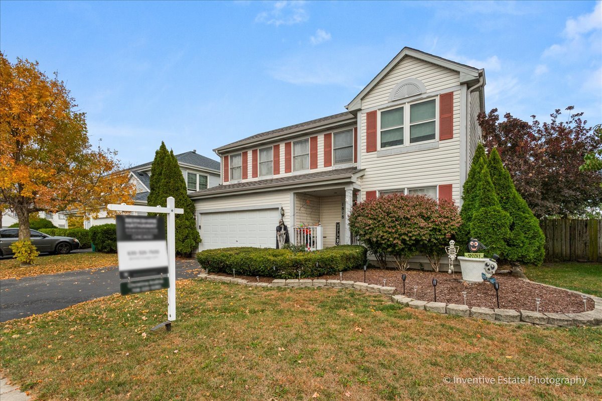 1818 Lobelia Lane Plainfield, IL 60586 - Photo 1 of 19 a front view of a house with a yard and garage