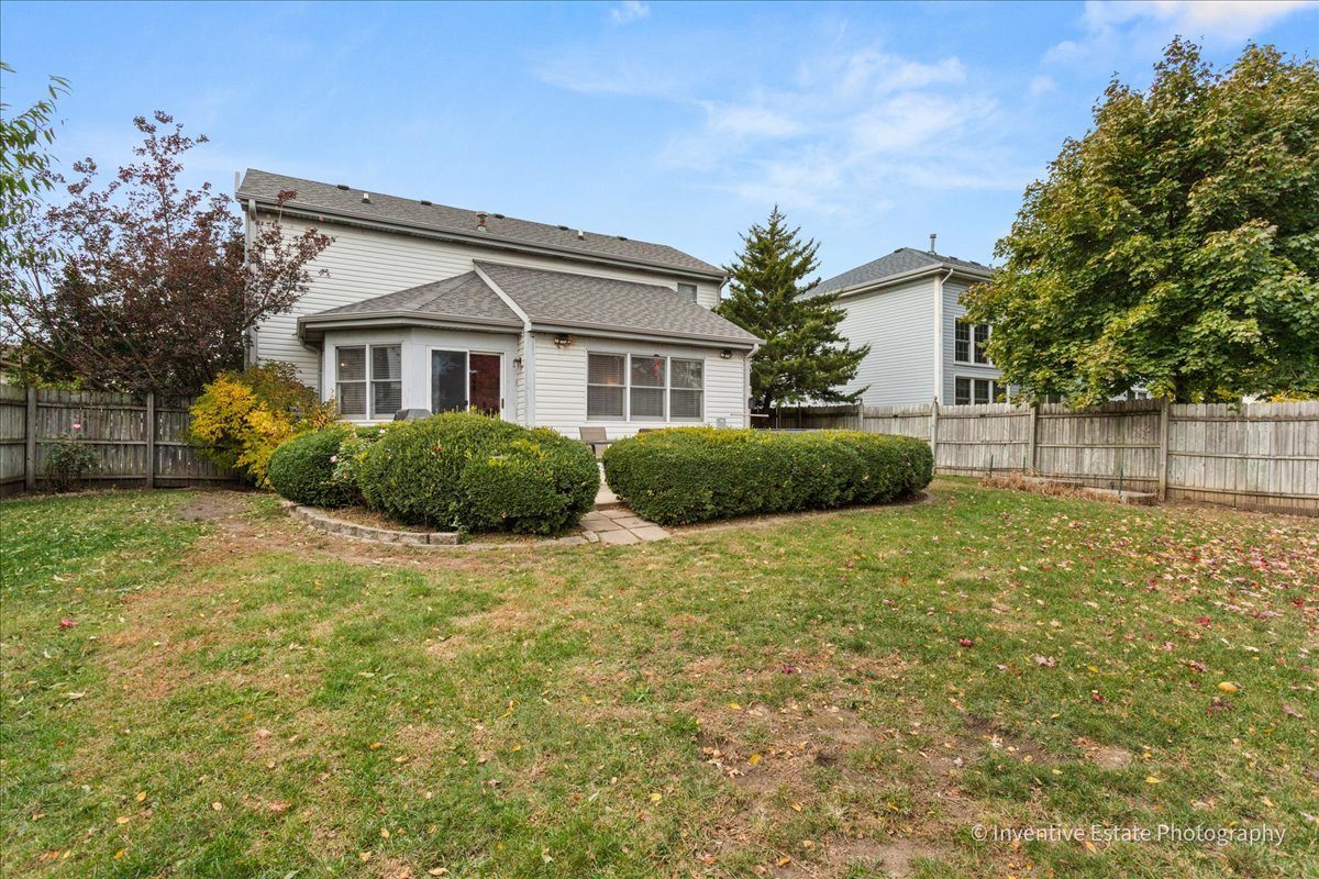 1818 Lobelia Lane Plainfield, IL 60586 - Photo 17 of 19 a front view of a house with garden
