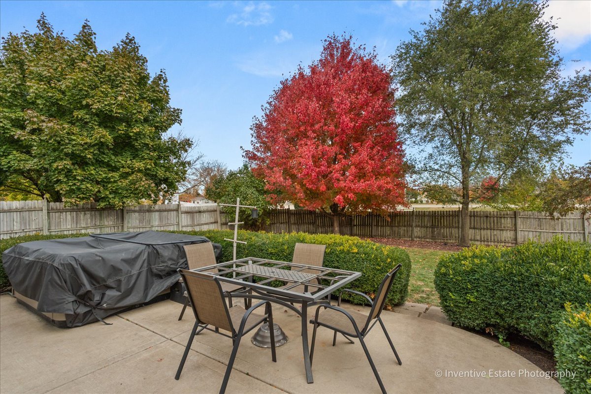 1818 Lobelia Lane Plainfield, IL 60586 - Photo 18 of 19 a view of a lake with table and chairs