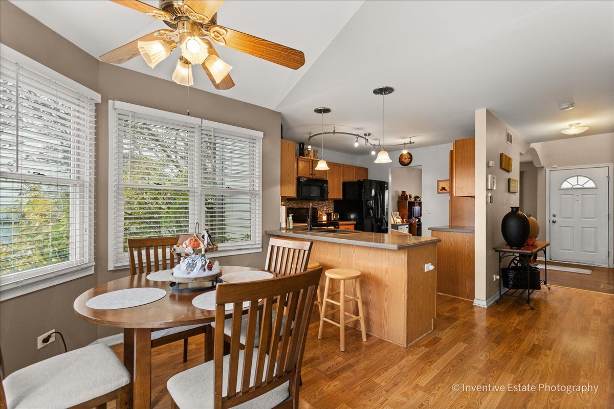 1818 Lobelia Lane Plainfield, IL 60586 - Photo 7 of 19 a view of a dining room with furniture window and outside view