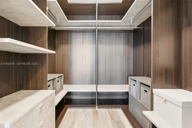 a bathroom with a sink and a large mirror