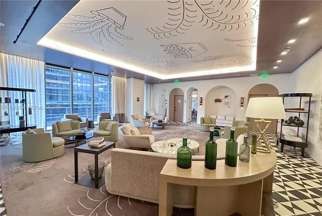 a living room with fireplace furniture and a window