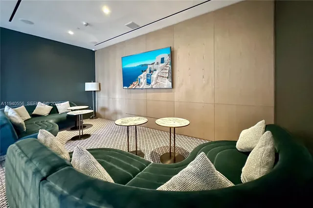 a living room with furniture and a rug